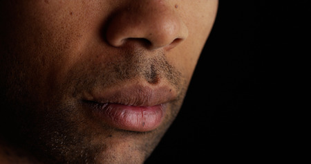Close up on African man's lipsの写真素材
