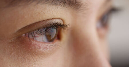 Closeup of Chinese woman's closed eyesの写真素材