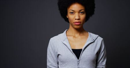 Athletic black woman standing looking at cameraの写真素材