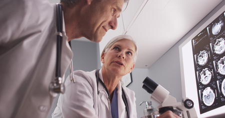 A couple of intelligent mature radiologists discussing research