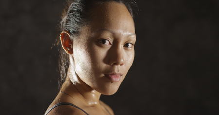 Fitness woman sweating taking a breath after working outの写真素材
