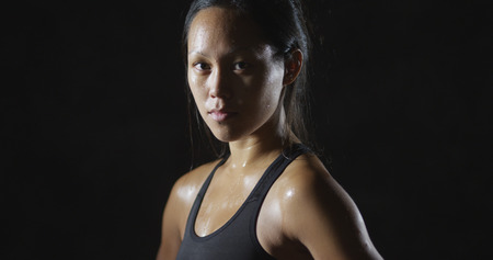 Portrait of active fitness woman sweating from workoutの写真素材