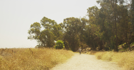 Mexican man riding bicycle on trailの写真素材