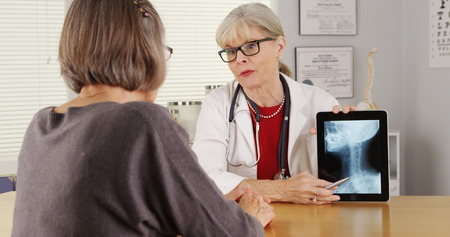 Senior doctor patient tablet x-rayの写真素材