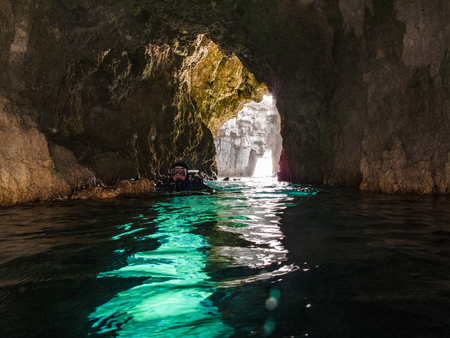 Surfacing in a Caveの写真素材