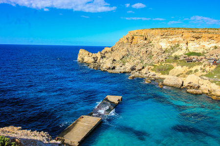Anchor Bay, Malta with broken jetty.のeditorial素材