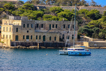A catamaran at its moorings in Sliema Creek, Sliema on the Mediterranean island of Malta.のeditorial素材