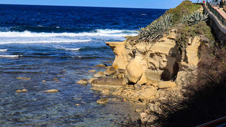 Cliff and cave against the Mediterranean sea at Marsalforn on the island of Gozo in the Maltese archipelago.の写真素材