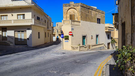 A fork in the road at St Gregory's Square, Kercem on the Mediterranean island of Gozo in the Maltese archipelago.の写真素材