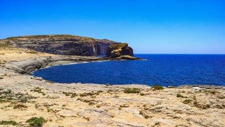 A seascape of Dweijra bay and Fungus rock on the Mediterranean island of Gozo in the Maltese archipelago.の写真素材