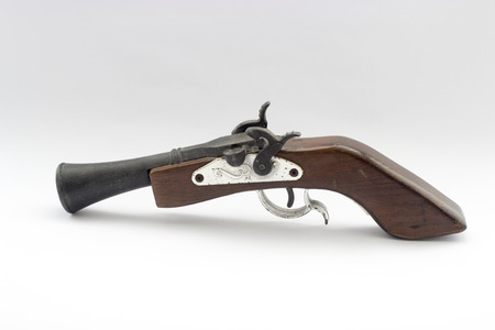 A relate ancient wood gun white isolated