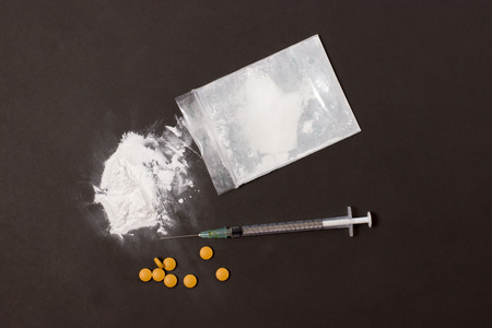 syringe and powder drug top view on gray backgroundの写真素材