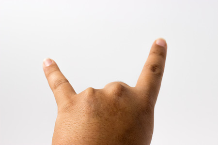 Hand of rocker isolated on white backgroundの写真素材