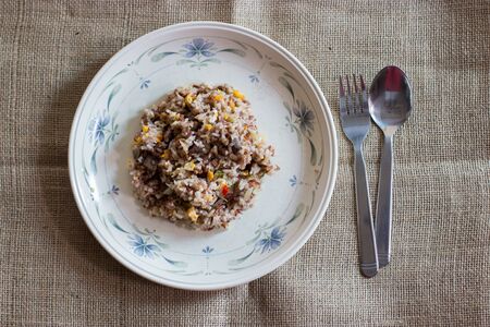 thai fried rice with beef and egg in top viewの写真素材