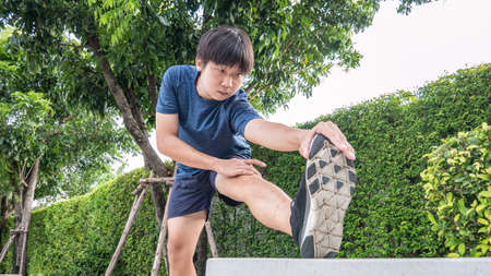 Young asian man streching at park