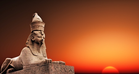 Egyptian Sphinx on the sunset sky backgroundの写真素材