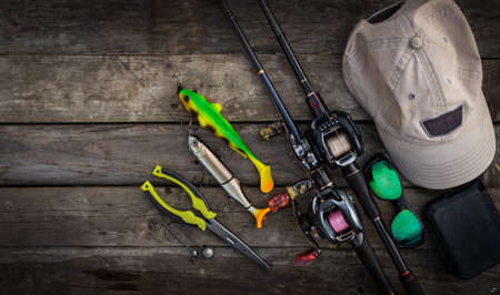 Fishing tackle on a wooden background. Top view with copy space.の写真素材