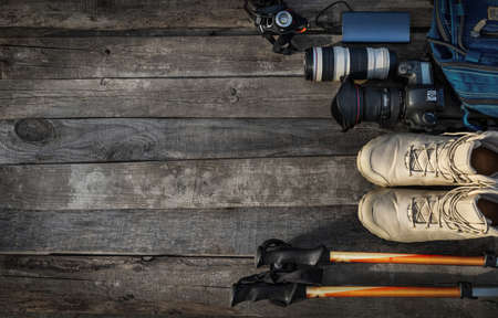 Set of hiking equipment on wooden background, top view. Space for textの写真素材