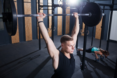 functional fitness workout at the gym with barbell