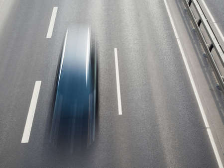 car blurred by speed at highwayの写真素材