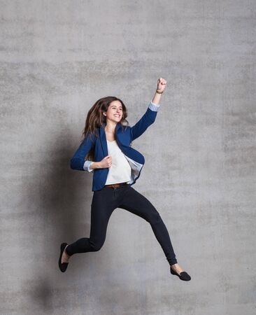 winner jump of sucessfull businesswomanの写真素材