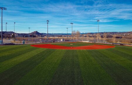 CASTLE ROCK, COLORADO/USA - MARCH 28 2019: Aerial drone video in the early morning of a freshly prepared local park baseball field ready for baseball opening day play.のeditorial素材