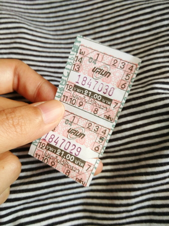 a pair of Thai bus tickets pricing 21 baht per each ticketのeditorial素材