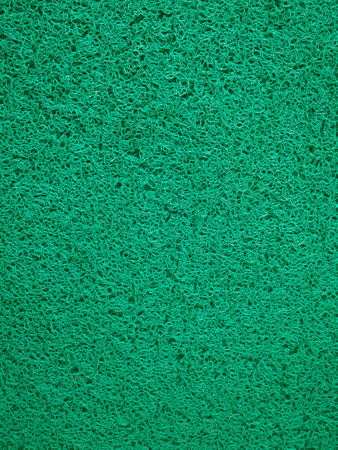 closeup shot of green vinyl dust trap carpet, top viewの写真素材