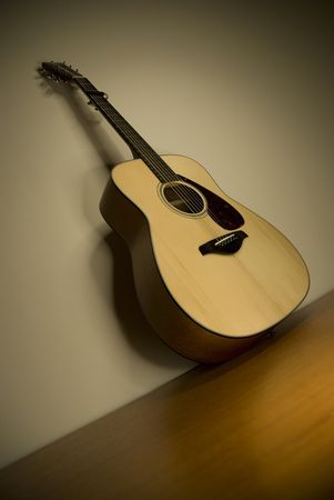 An acoustic guitar is a guitar that uses only acoustic methods to project the sound produced by its strings.の写真素材
