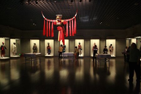 Shanghai, China - March 31, 2010 - Shanghai Museum Minority traditional clothing exhibitionのeditorial素材
