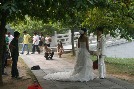 Zhaoqing, China - May 10, 2012 -  Photographers taking wedding photos on Seven Star Crags Parkのeditorial素材