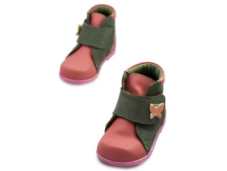 first children shoes isolated on white backgroundの写真素材