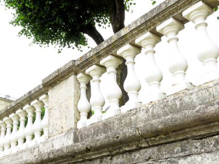palace of white stone railing against a gray skyの写真素材