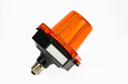 Red light bulb on a white background in studio