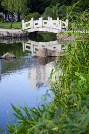 Garden with arch stone bridge