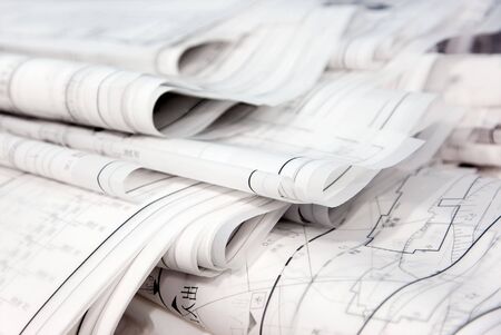 Several  blueprints stack on an a tableの写真素材