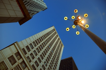 Looking up at the architecture of Skyscrapers and streetlight with blue sky background in a  modern city .の写真素材