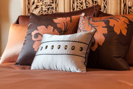 Luxury hotel room setting with bed and pillows の写真素材