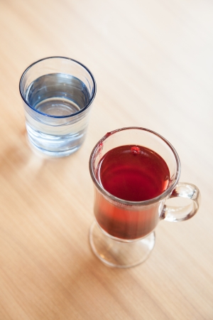 Red cranberry fruit drinks and vodka in glass の写真素材