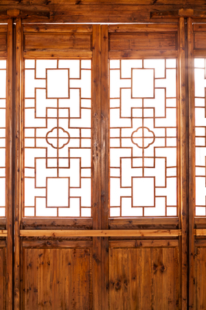 Closeup Chinese old wooden frame door with decorative patternの写真素材