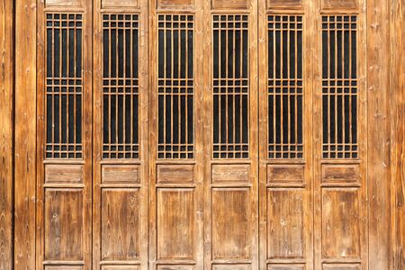The traditional  wooden door with lattice windows,which has the style of typical architecture of...