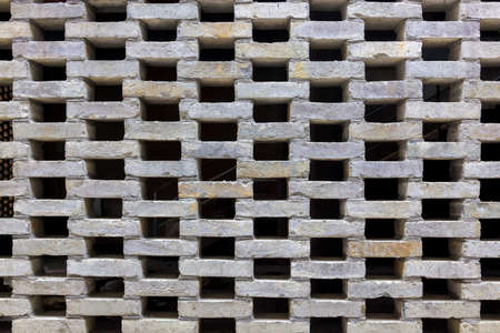 black hole and brick wall background texture, part of traditional Chinese brick window lattice in the southeast of Chinaの写真素材