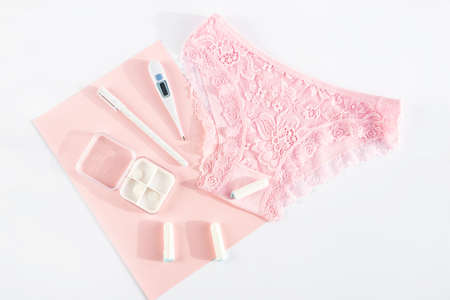 Woman panties and intimate hygiene products. Concept of menstruation, womans health, menstrual cycle, virginity, critical days, hygiene protection, pms, pain. Top view, flatlyの写真素材