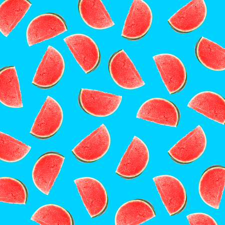 Fruit pattern of fresh watermelon slices on blue backgroundの写真素材