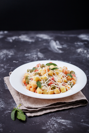 Classic italian lunch with Gnocchi with sage, butter and Parmesaの写真素材
