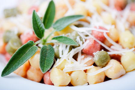 Classic italian lunch with Gnocchi with sage, butter and Parmesaの写真素材