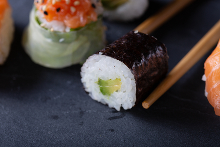 Japanese sushi on black background with copy space for text. Soft focus. Asian cousine.の写真素材