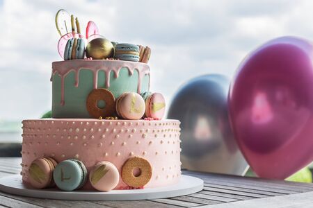 Colorful homemade macarons cake on pyramid in many levelsの写真素材