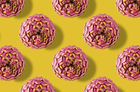 Whole artichoke vegetables pattern on colorful backgroundの写真素材