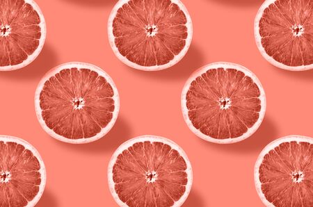 Vivid fruit pattern of fresh grapefruit on colourful background